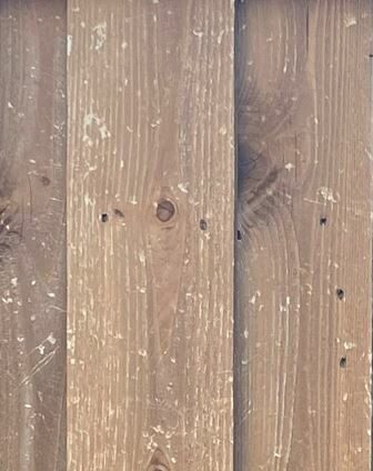 Hail damage to wood fence